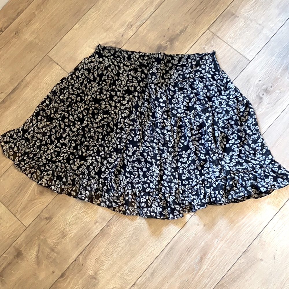 Black and white woman’s skull skirt